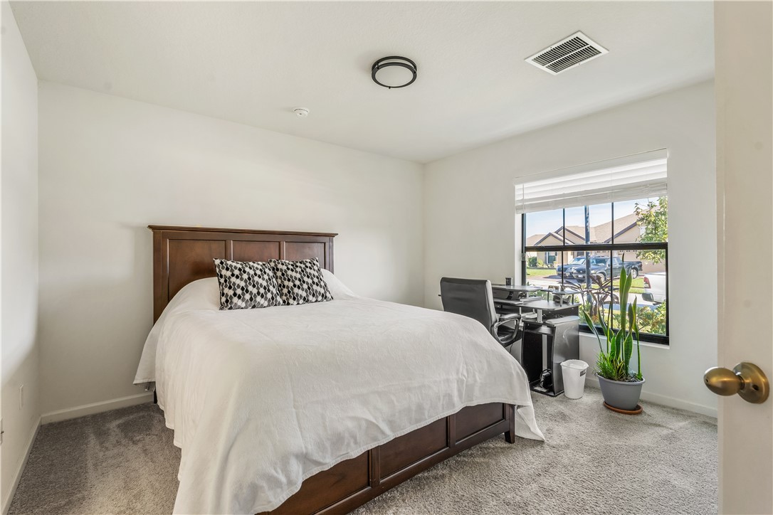 5760 1st Road Vero Beach, FL 32968 - Photo 23 of 36 a bedroom with bed and a window