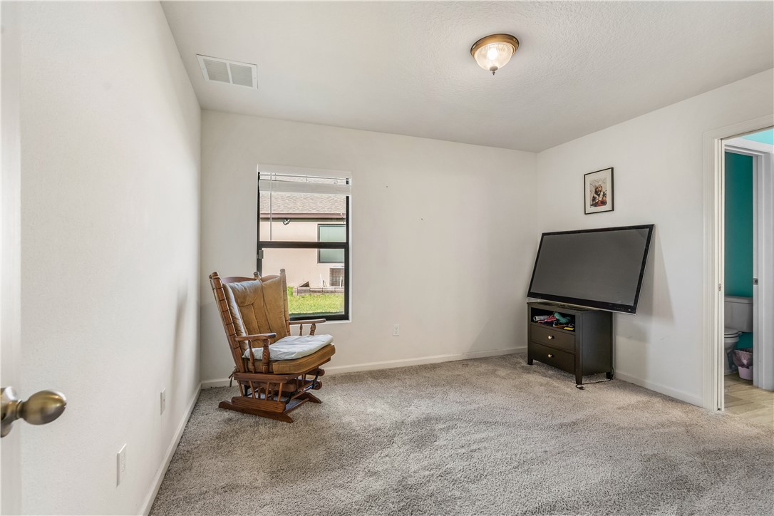5760 1st Road Vero Beach, FL 32968 - Photo 25 of 36 a living room with furniture and a air conditioner vent