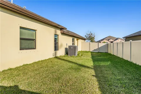 a view of a lake with houses in the back