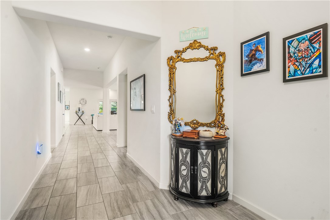 5760 1st Road Vero Beach, FL 32968 - Photo 7 of 36 a view of hallway with wooden floor and front door