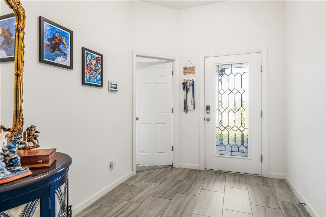 5760 1st Road Vero Beach, FL 32968 - Photo 8 of 36 a view of an entryway with wooden floor