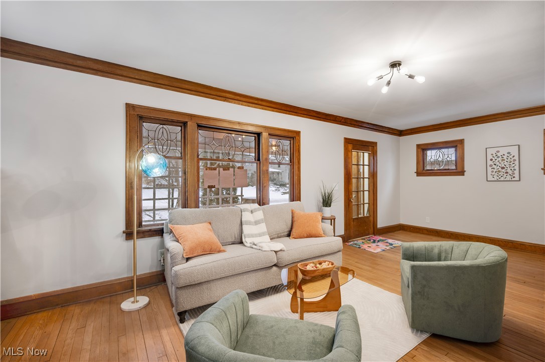 2016 Rossmoor Road Cleveland Heights, OH 44118 - Photo 6 of 46 Living room with wood-type flooring and ornamental molding