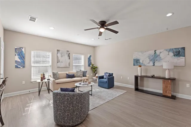 a view of a dining room with furniture and wooden floor
