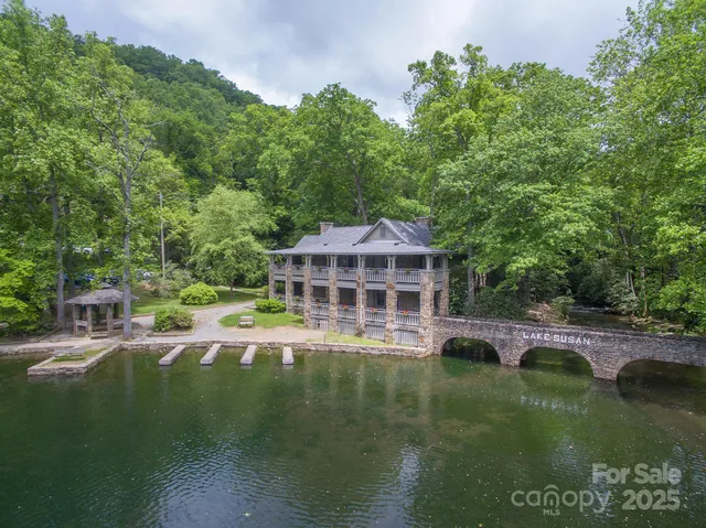 a view of a lake with a house in the background