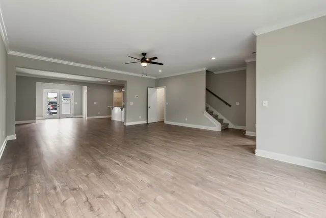 a view of kitchen with wooden floor and electronic appliances