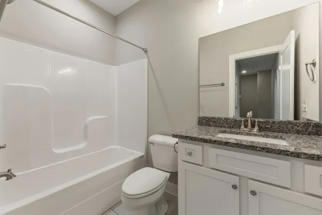 a view of a brick house with a large door