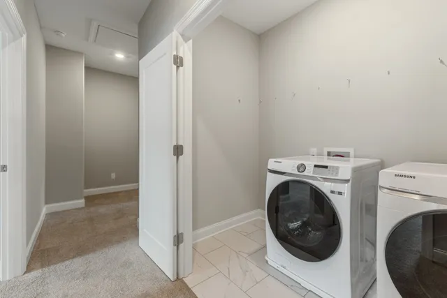 an aerial view of residential houses with yard