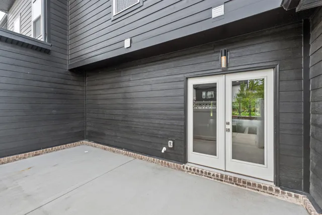 a front view of a house with yard and green space