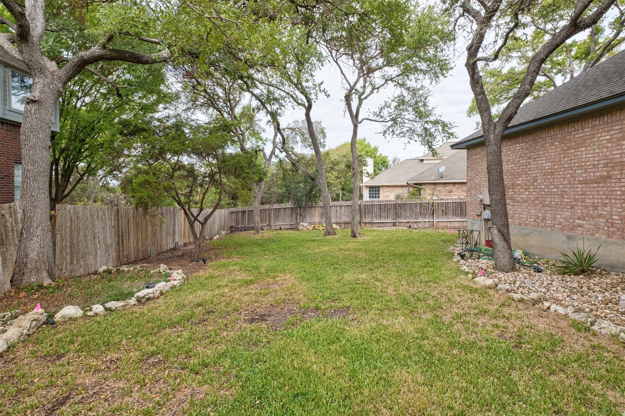 3704 Runnels Court Austin, TX 78732 - Photo 25 of 30 View of yard featuring a fenced backyard
