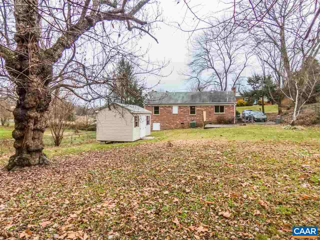 253 Locust Lane Ruckersville, VA 22968 - Photo 32 of 38 a view of a yard with a house and a large tree
