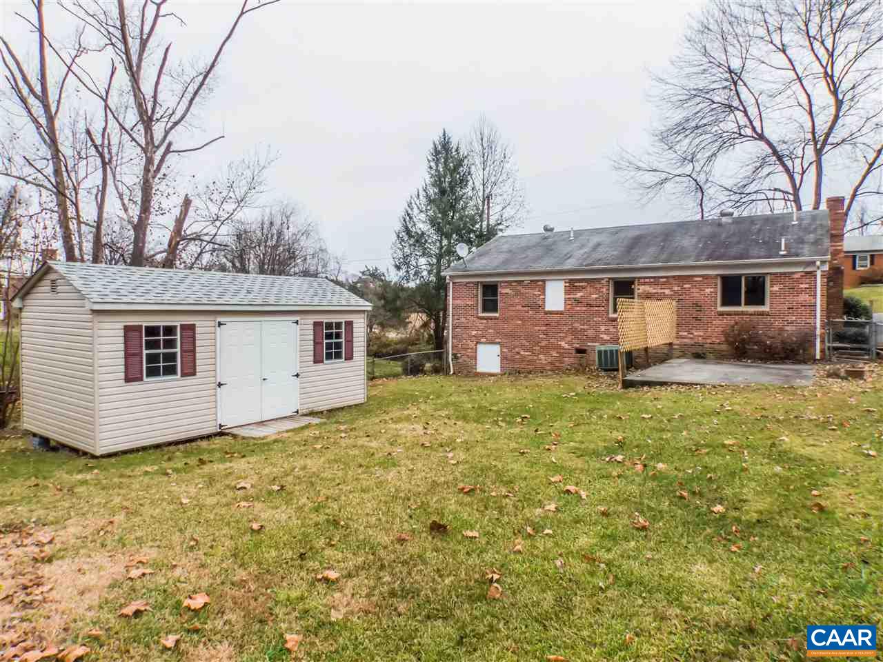 253 Locust Lane Ruckersville, VA 22968 - Photo 6 of 38 a front view of house with yard and trees in the background