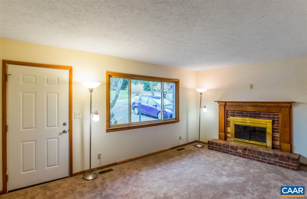 253 Locust Lane Ruckersville, VA 22968 - Photo 9 of 38 an empty room with windows fire place and an entrance
