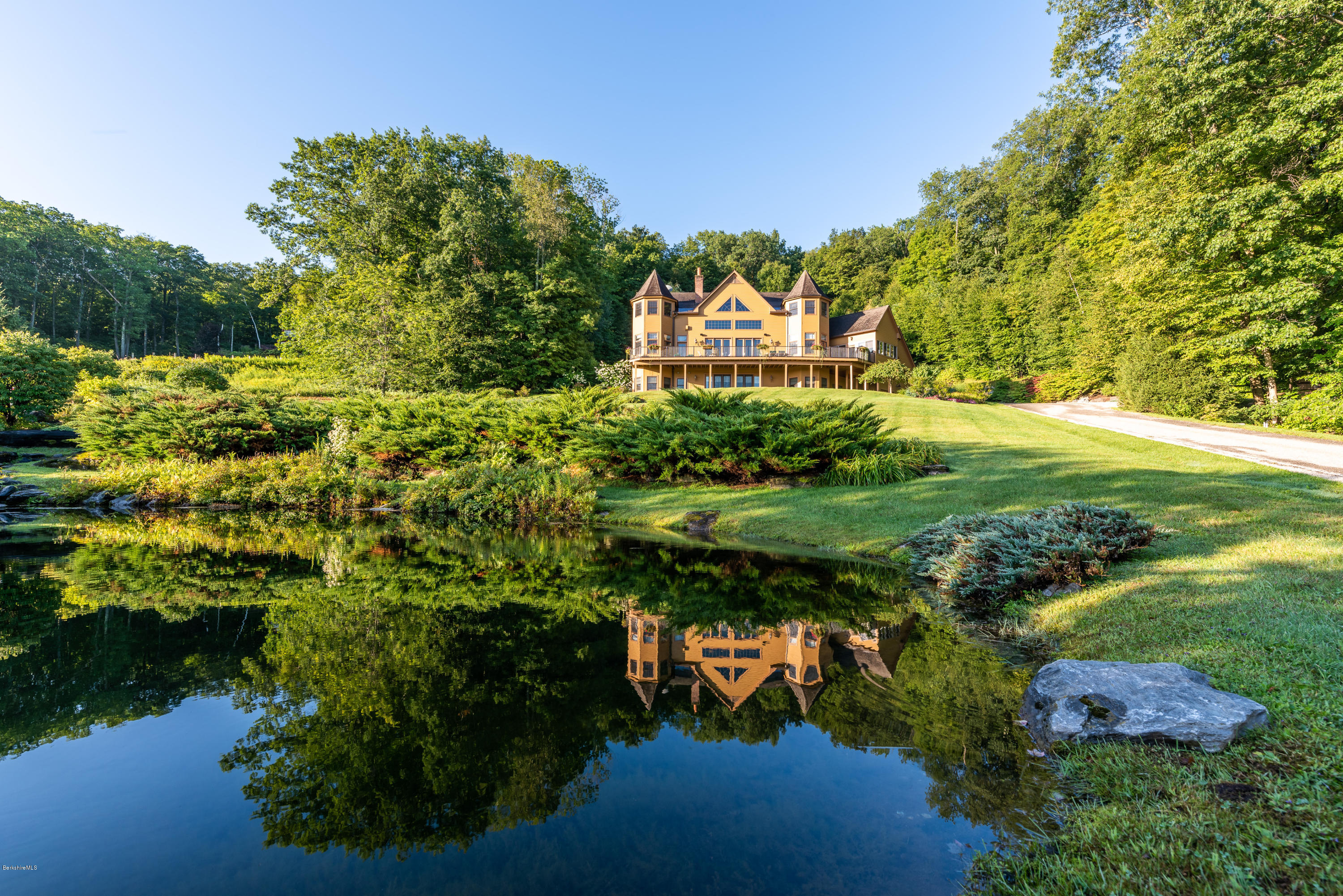 60 West Center Road West Stockbridge, MA 01266 - Photo 1 of 1 a view of a garden with plants and large trees