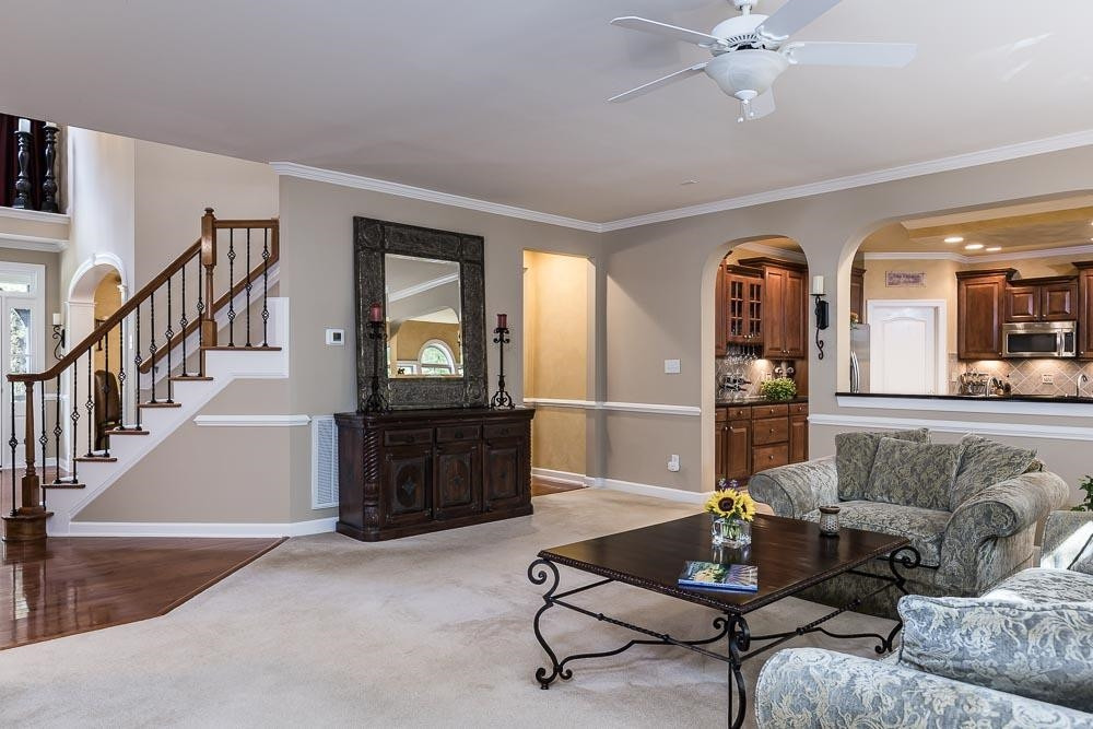 8236 Clarks Branch Drive Raleigh, NC 27613 - Photo 10 of 30 Alternate shot showing the front door, gorgeous staircase, the pass thru for the Bulter's pantry, and the kitchen access. Family Room