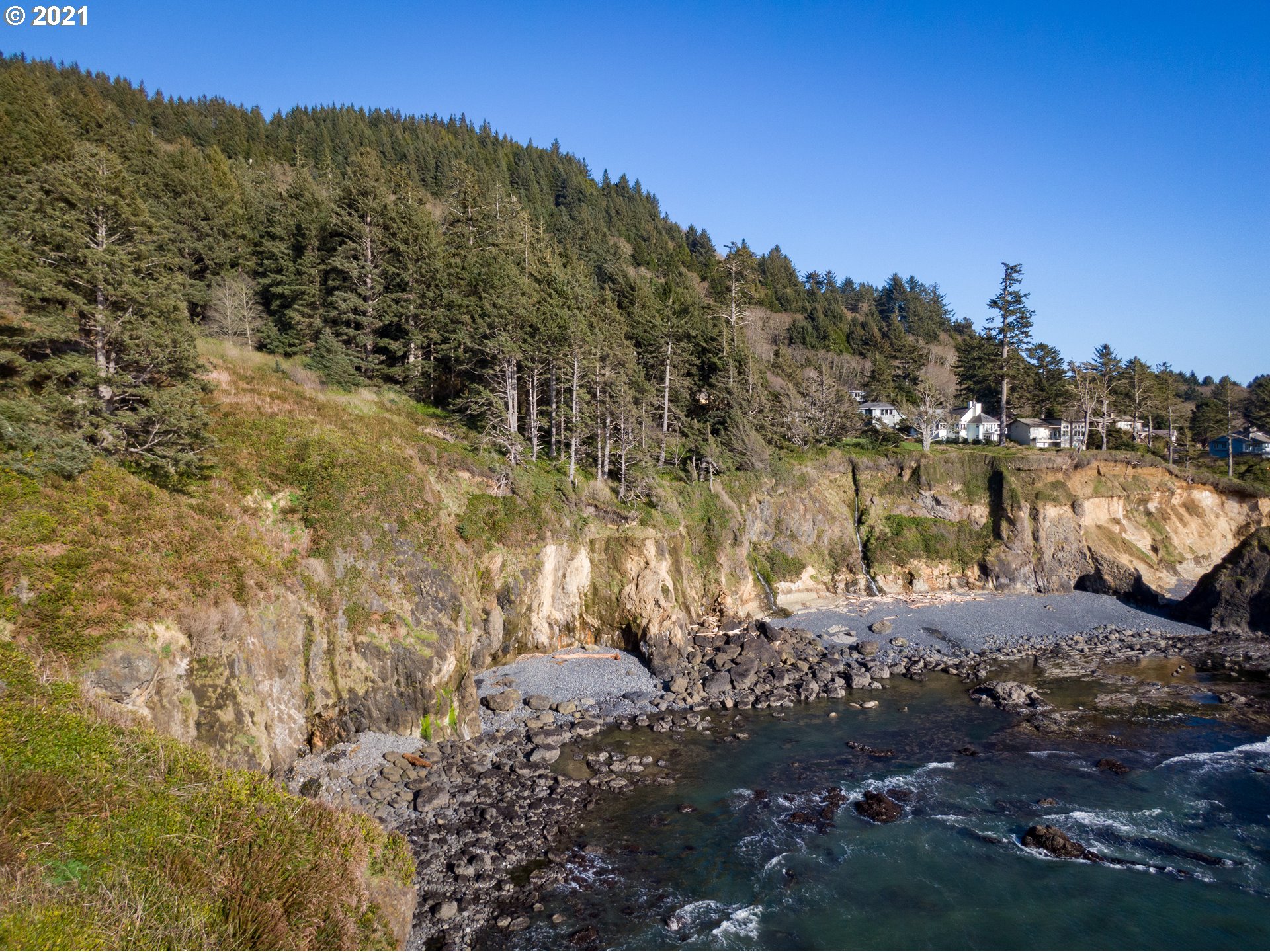 Otter Crest Loop, Unit 401 Depoe Bay, OR 97341 - Photo 3 of 7 a view of a city with mountains in the background