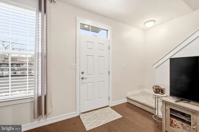 a view of a livingroom with furniture and a flat screen tv