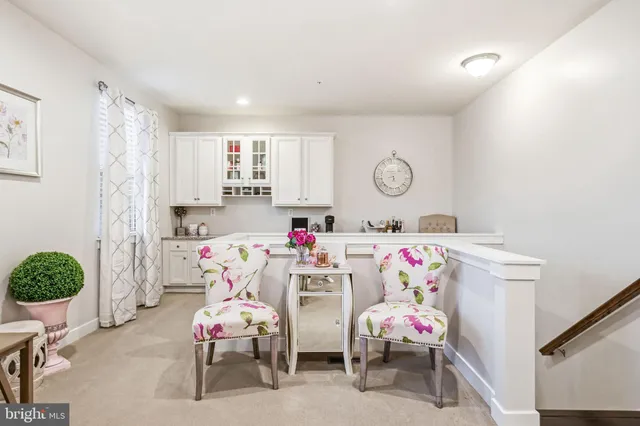 a bedroom with furniture and a fan