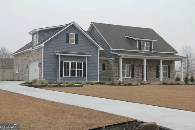 front view of a house with a yard