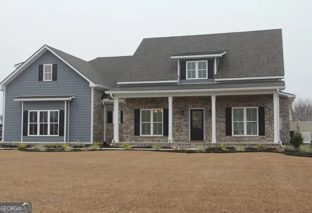 front view of a house with a yard