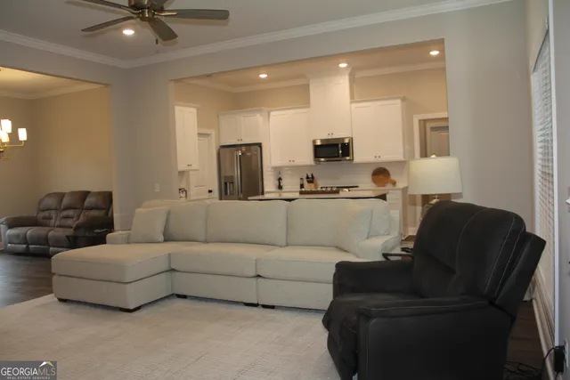 a white bath tub sitting next to a toilet