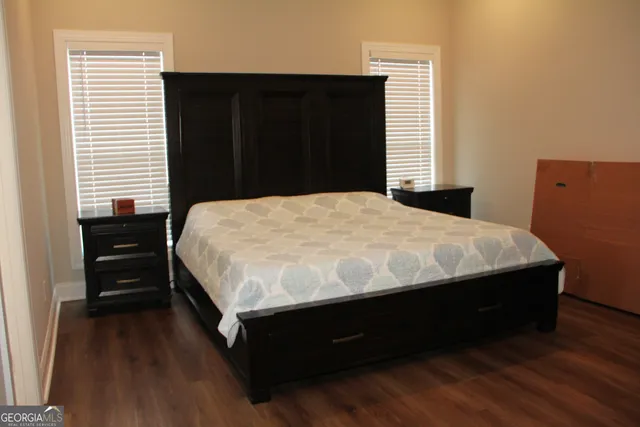 a bathroom with a double vanity sink and mirror