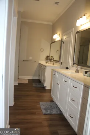 a bathroom with a glass shower door