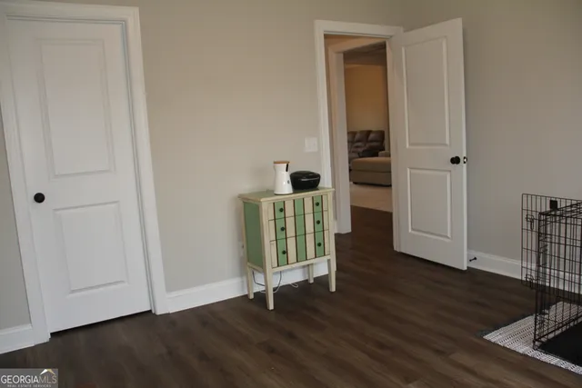 a view of a house with a yard and fence