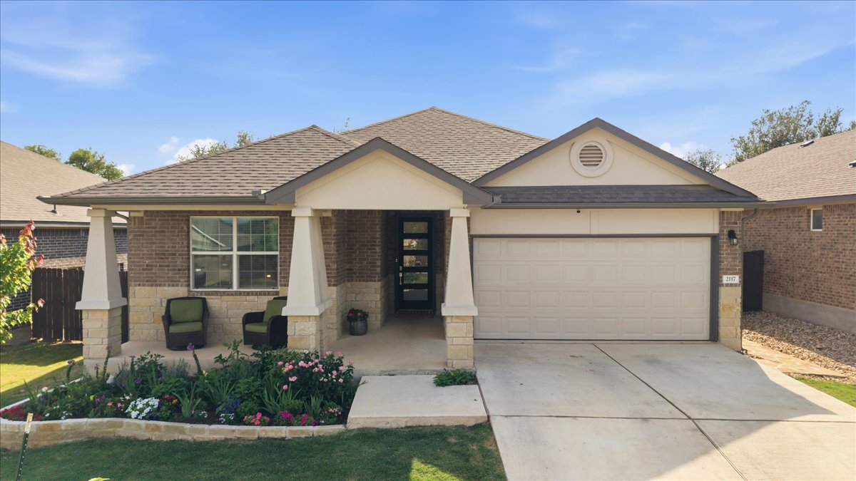 a front view of a house with garden