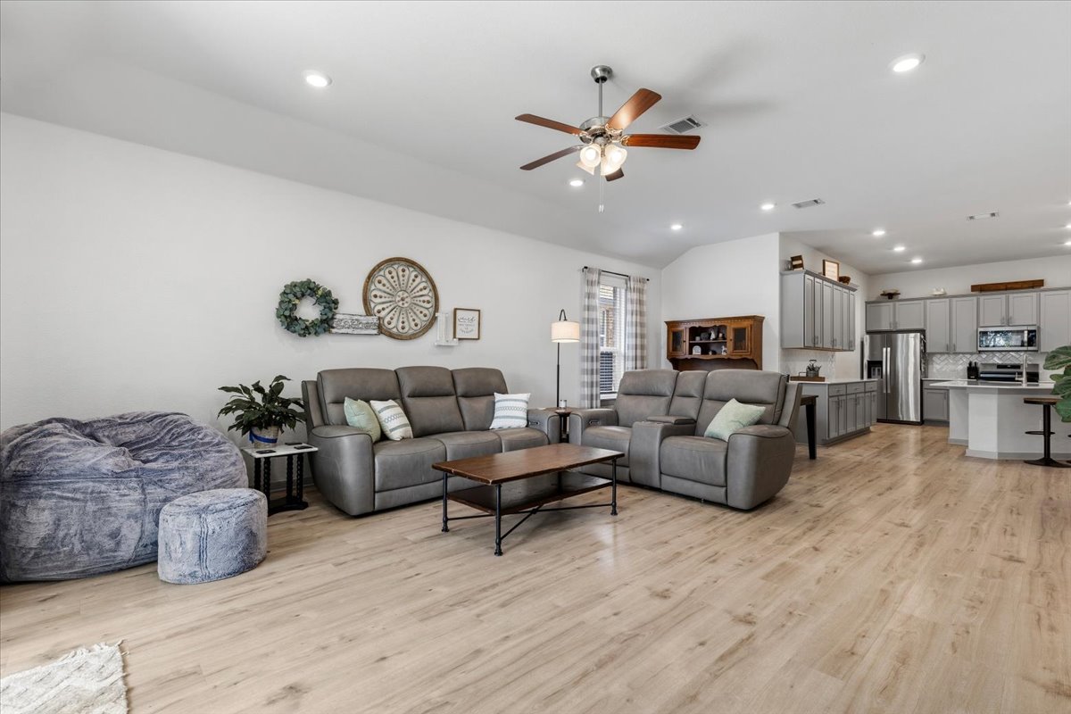 2117 Centerline Lane Georgetown, TX 78628 - Photo 14 of 31 a living room with furniture kitchen view and a chandelier