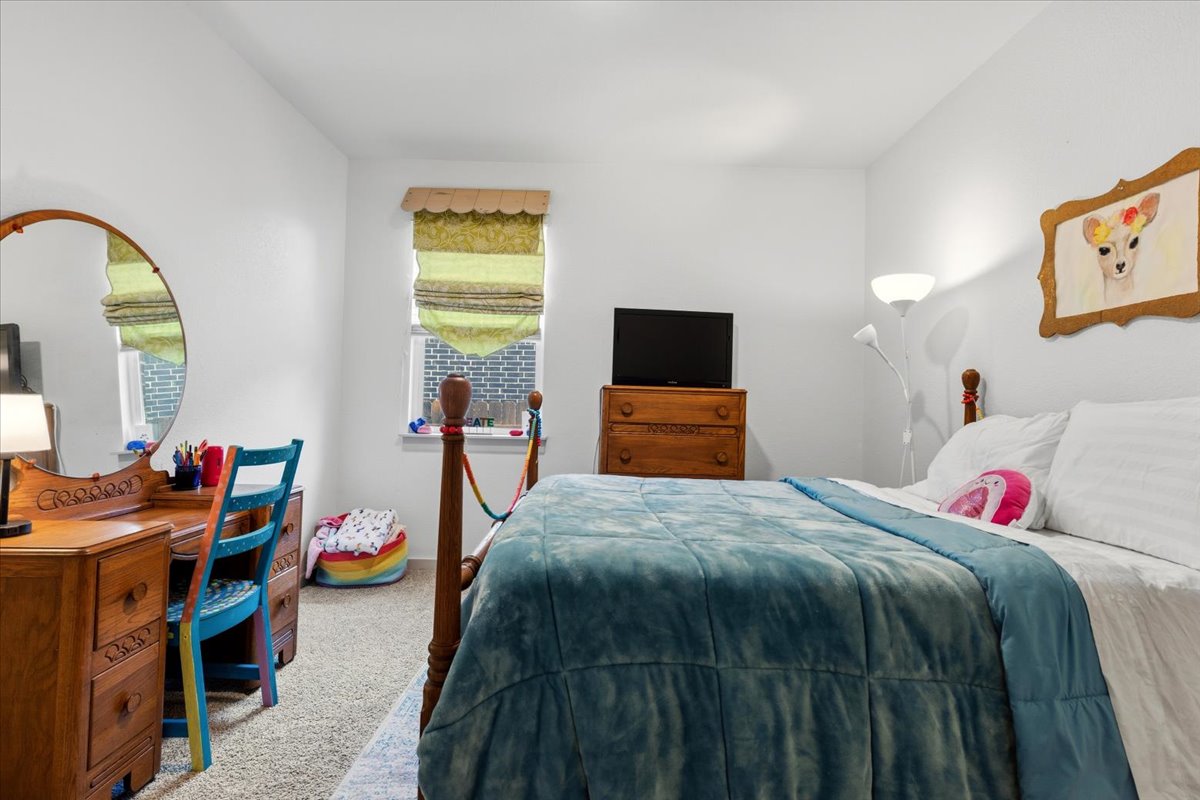 2117 Centerline Lane Georgetown, TX 78628 - Photo 23 of 31 a bed room with a bed and a television