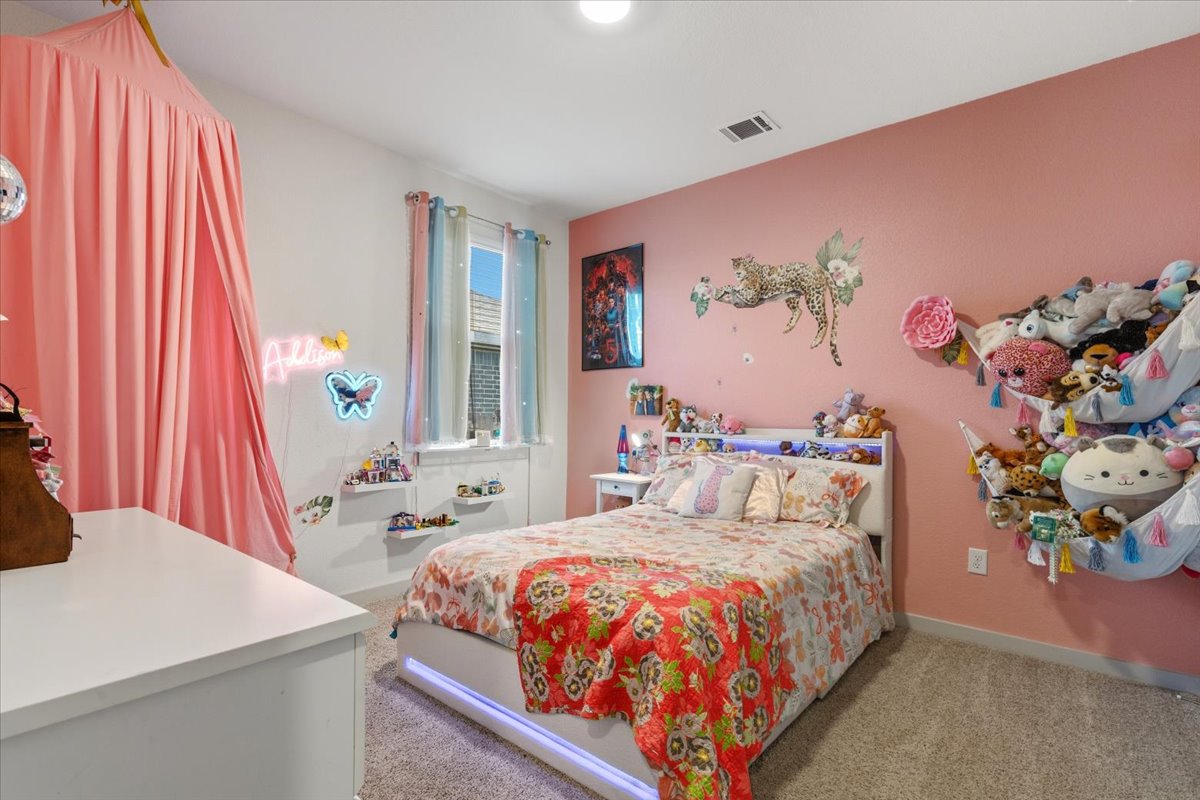 2117 Centerline Lane Georgetown, TX 78628 - Photo 26 of 31 a bedroom with a bed and a painting on the wall