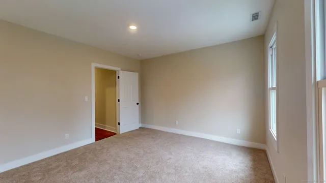 a white toilet sitting next to a bath tub