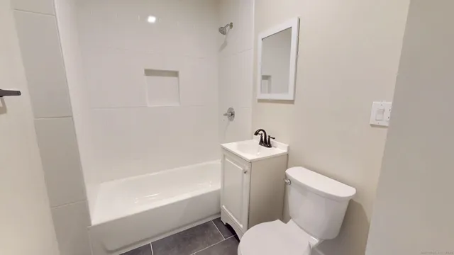 a view of a deck with a white fence