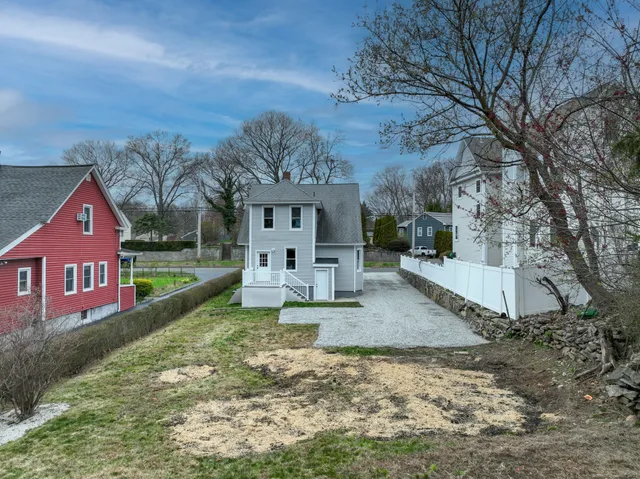 a view of house with outdoor space and sitting area