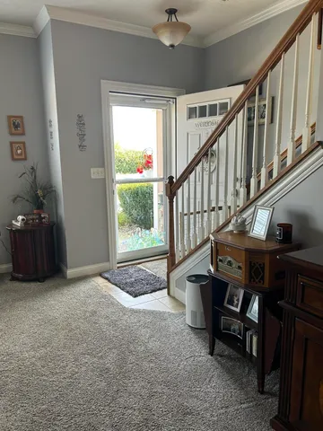 a view of an entryway with wooden floor