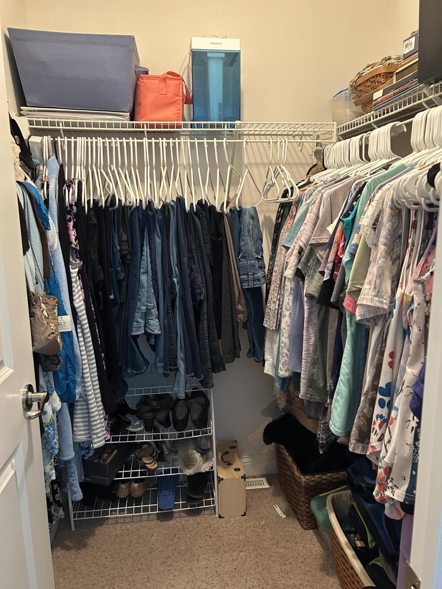 6029 Lexington Avenue Portage, IN 46368 - Photo 22 of 24 a view of walk in closet with clothes and shoes
