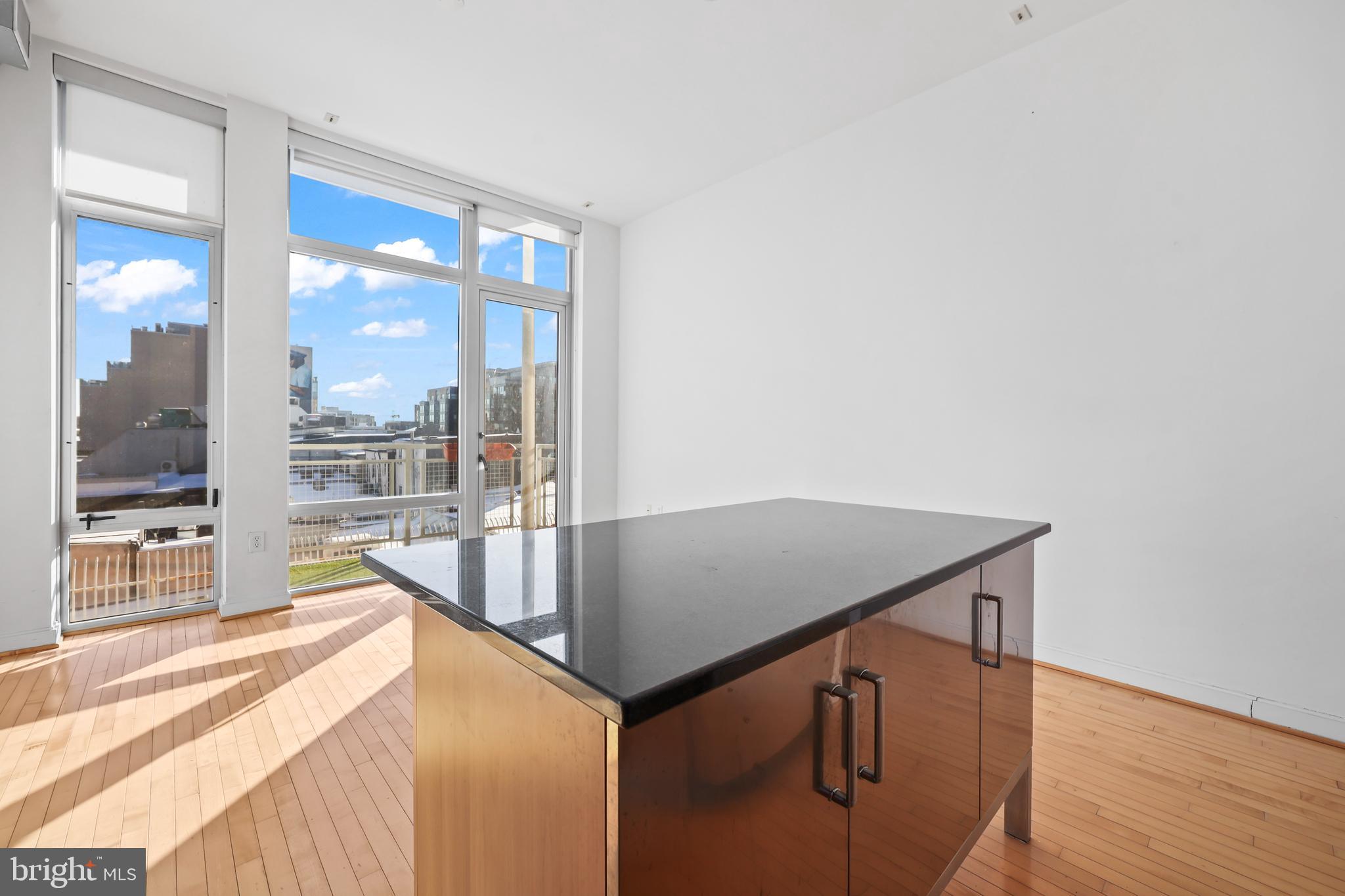 1390 V Street Northwest, Unit 307 Washington, DC 20009 - Photo 12 of 34 a view of balcony and kitchen