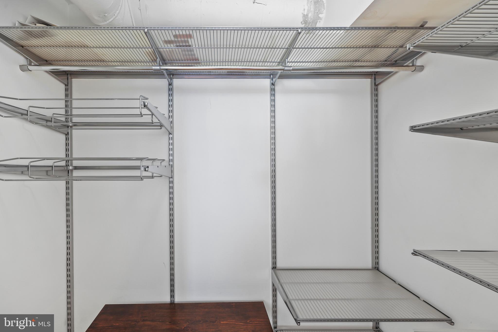 1390 V Street Northwest, Unit 307 Washington, DC 20009 - Photo 18 of 34 a view of a room with racks on the wall