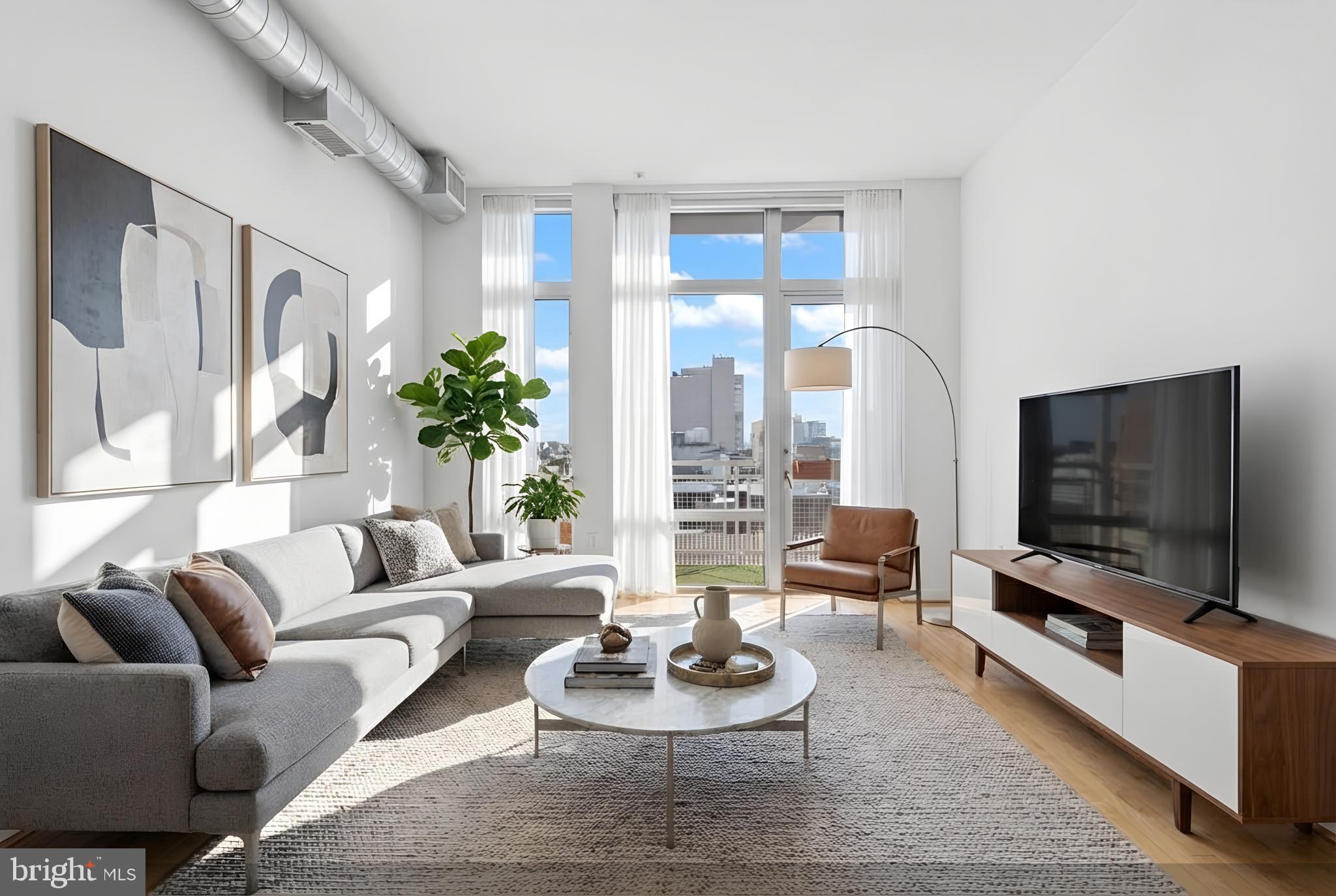 1390 V Street Northwest, Unit 307 Washington, DC 20009 - Photo 3 of 34 a living room with furniture and a flat screen tv