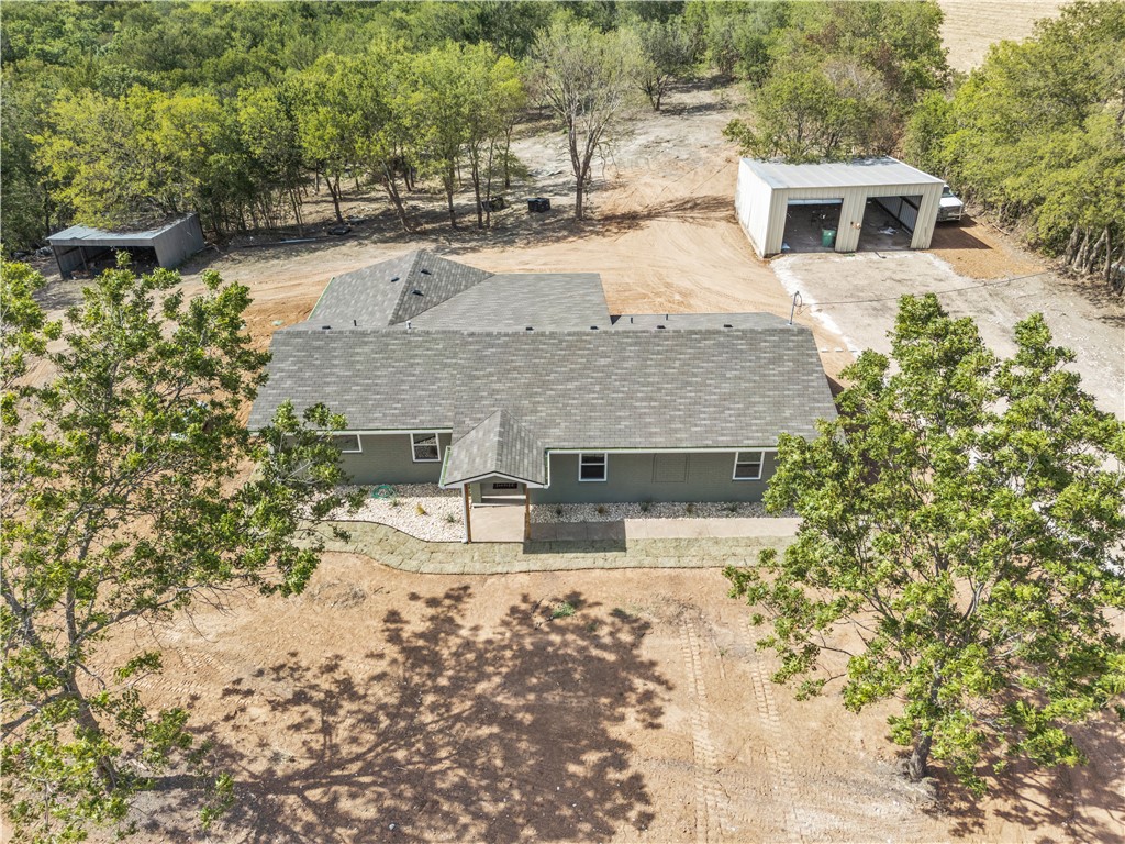a front view of a house with yard and seating area