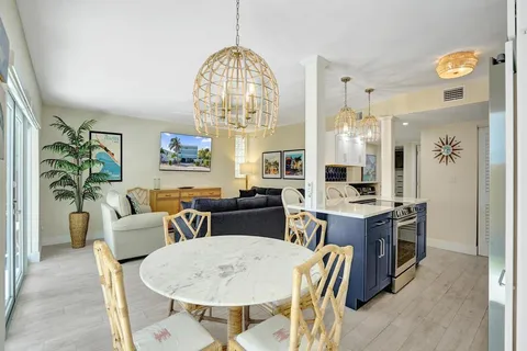 a kitchen with a refrigerator a sink and a cabinets