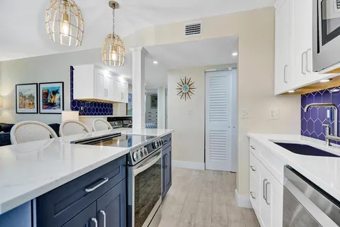 a living room with furniture and a ceiling fan
