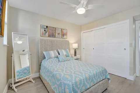 a bedroom with a bed and a chair