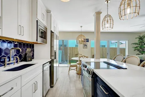 a kitchen with a sink and a refrigerator