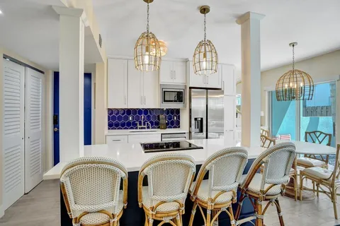 a view of kitchen with sink and breakfast area