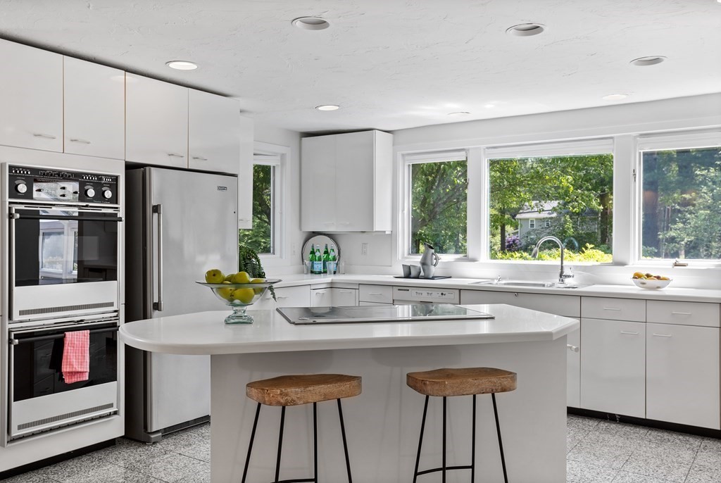 11 Farrar Road Lincoln, MA 01773 - Photo 12 of 37 a kitchen with stainless steel appliances granite countertop a sink and a stove