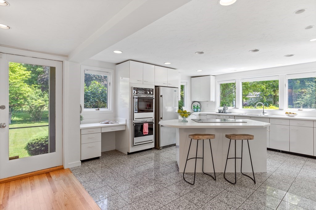 11 Farrar Road Lincoln, MA 01773 - Photo 15 of 37 a kitchen with sink cabinets and dining table