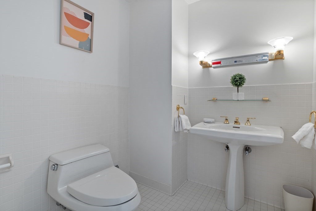 11 Farrar Road Lincoln, MA 01773 - Photo 19 of 37 a bathroom with a sink a toilet and a mirror