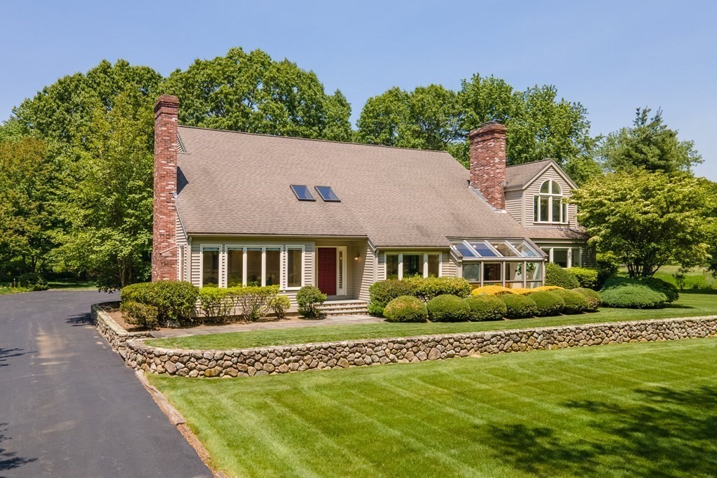 11 Farrar Road Lincoln, MA 01773 - Photo 2 of 37 a front view of a house with a garden