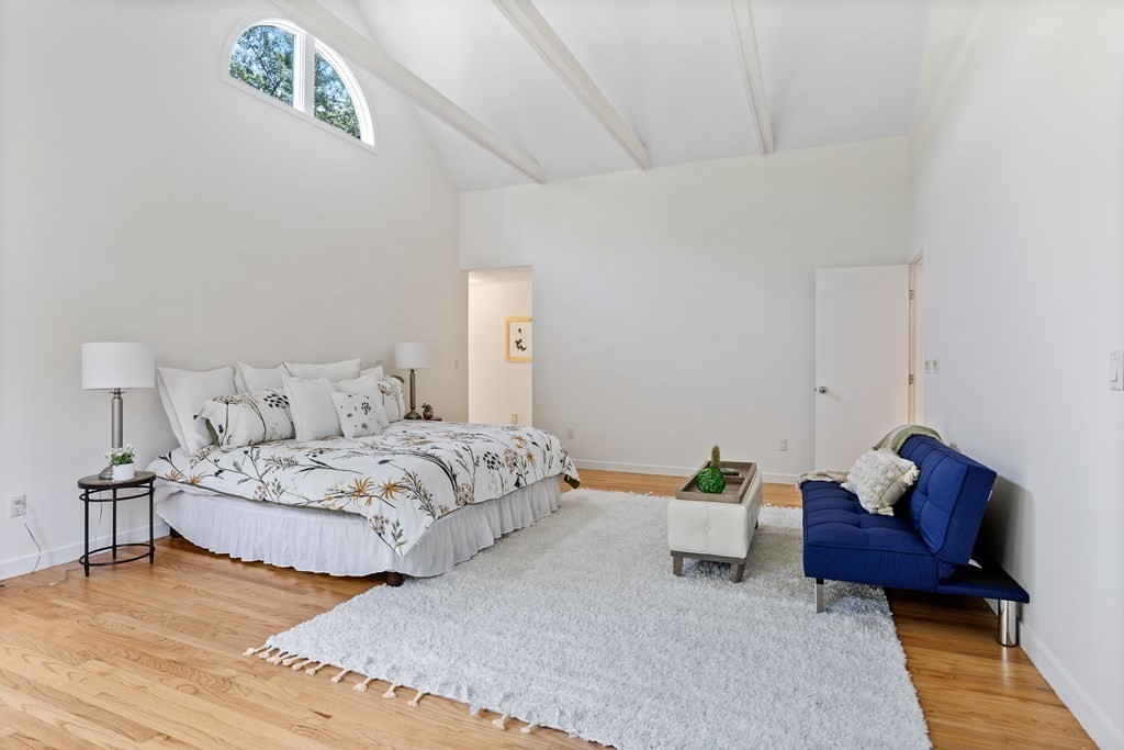 11 Farrar Road Lincoln, MA 01773 - Photo 23 of 37 a bedroom with a bed and a couch